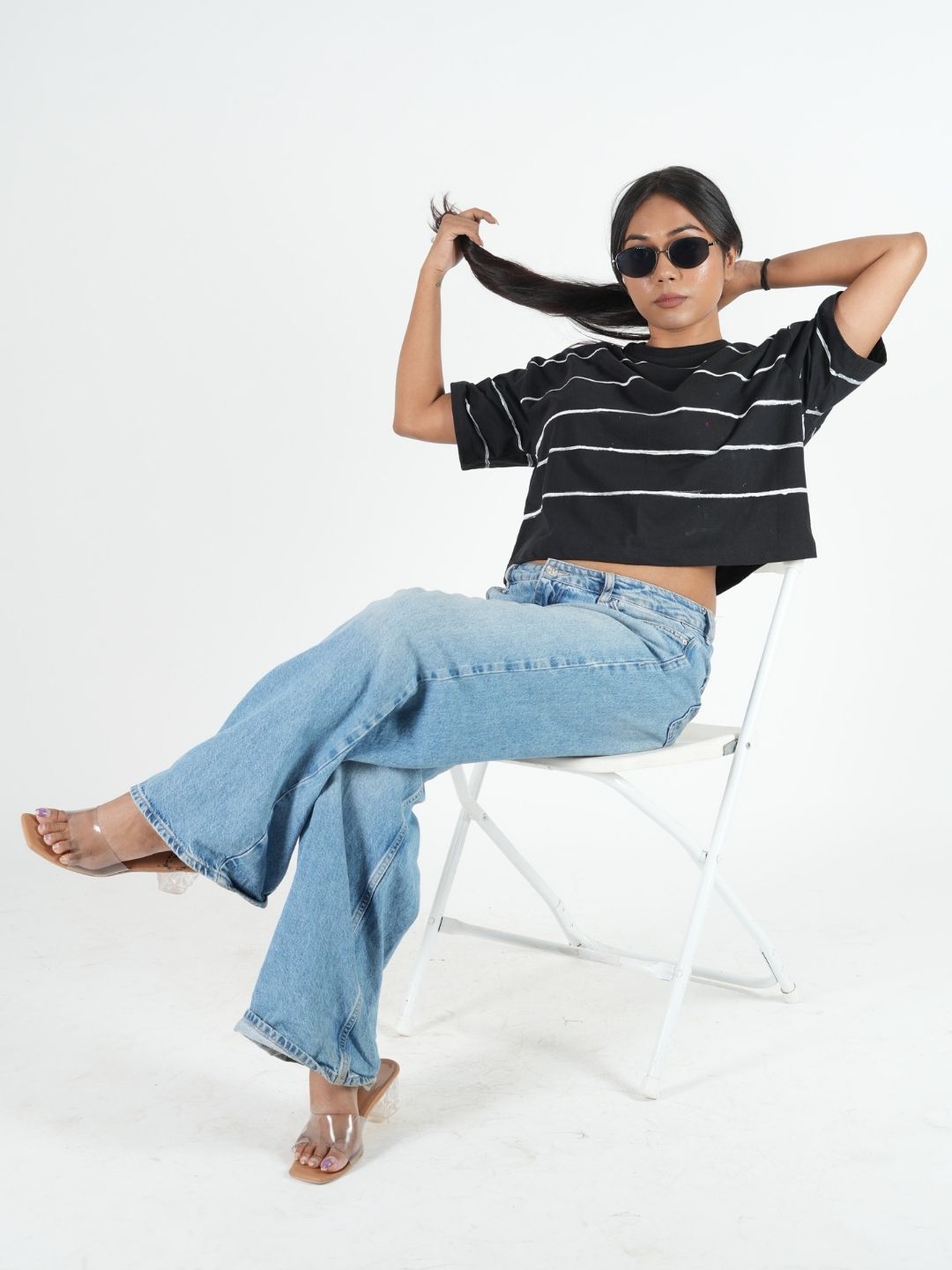 Stylish model wearing a Black Artistic Crop Top Oversized T-shirt, perfect for casual outfits and summer vibes.